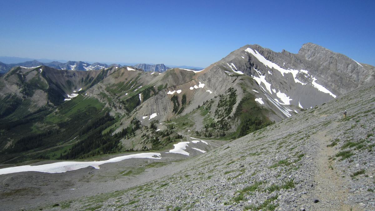 A scree trail along a high ridge toward rocky peaks above the Elk Valley near Fernie.