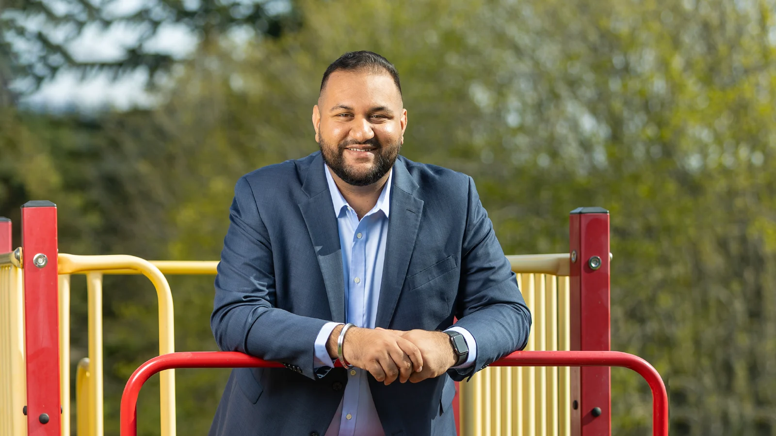 Ravi Parmar, British Columbia's Minister of Forests, photographed outdoors in a dark suit.