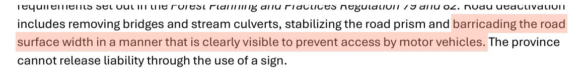 The FAQ line: barricading the road surface width in a manner that is clearly visible to prevent access by motor vehicles.