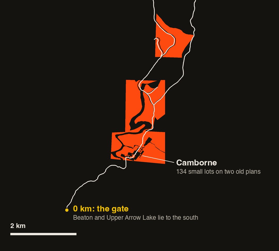 A dark map of the lower Incomappleux valley showing the forest service road as a white line running north from a yellow dot marking the 0 km gate, with large orange blocks of privately titled land along it and the Camborne lots.
