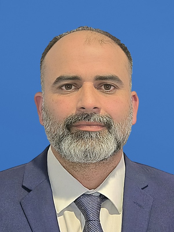 Portrait of Garry Purewal, in party colour.